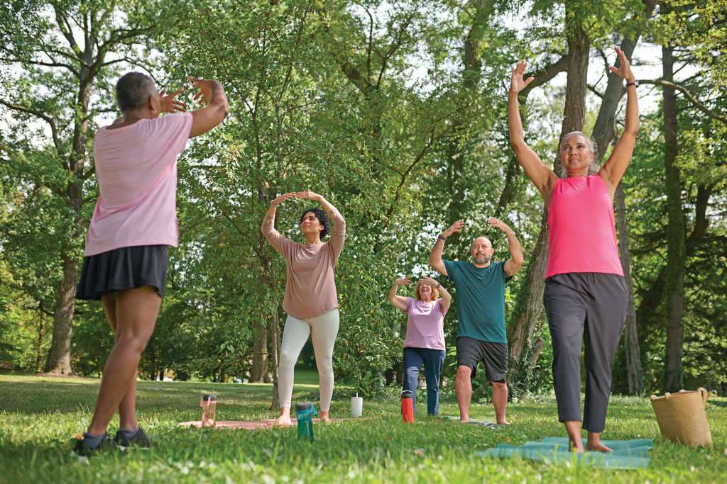 Women smiling with yoga mats