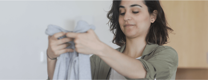 woman folding laundry