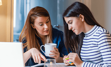 mother drinking tea with daughter