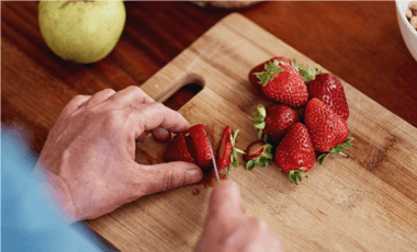 chopping strawberries