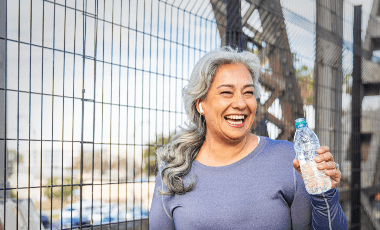 woman exercising drinking water