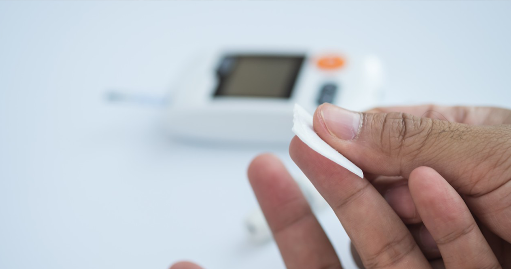 Individual checking blood sugar