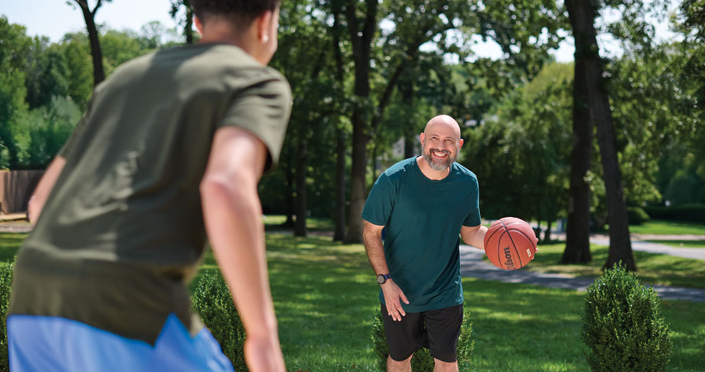 Two men playing basketball 
