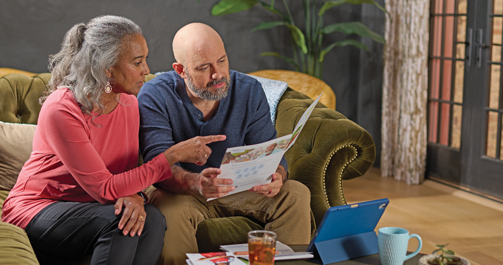 Woman and man reading pamphlet