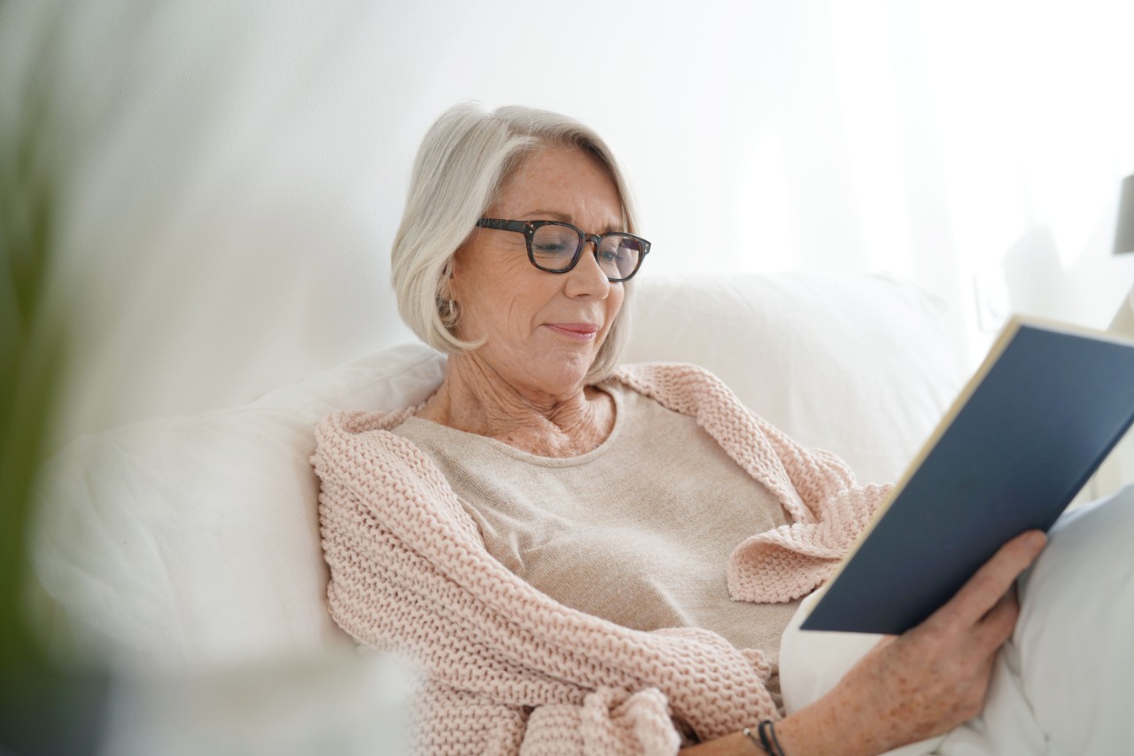 Woman sitting and reading a book